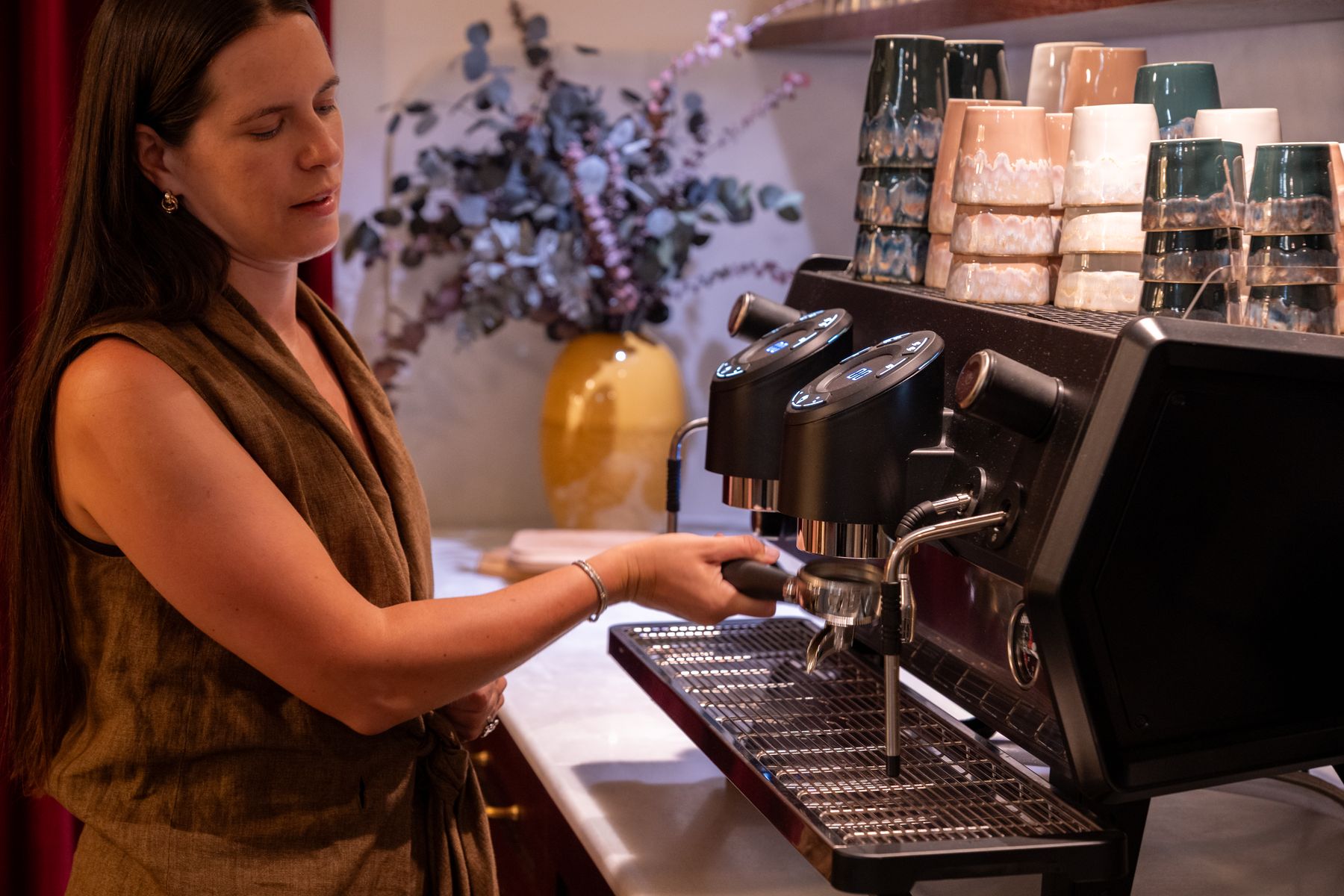 Barista pulling a shot at the espresso machine