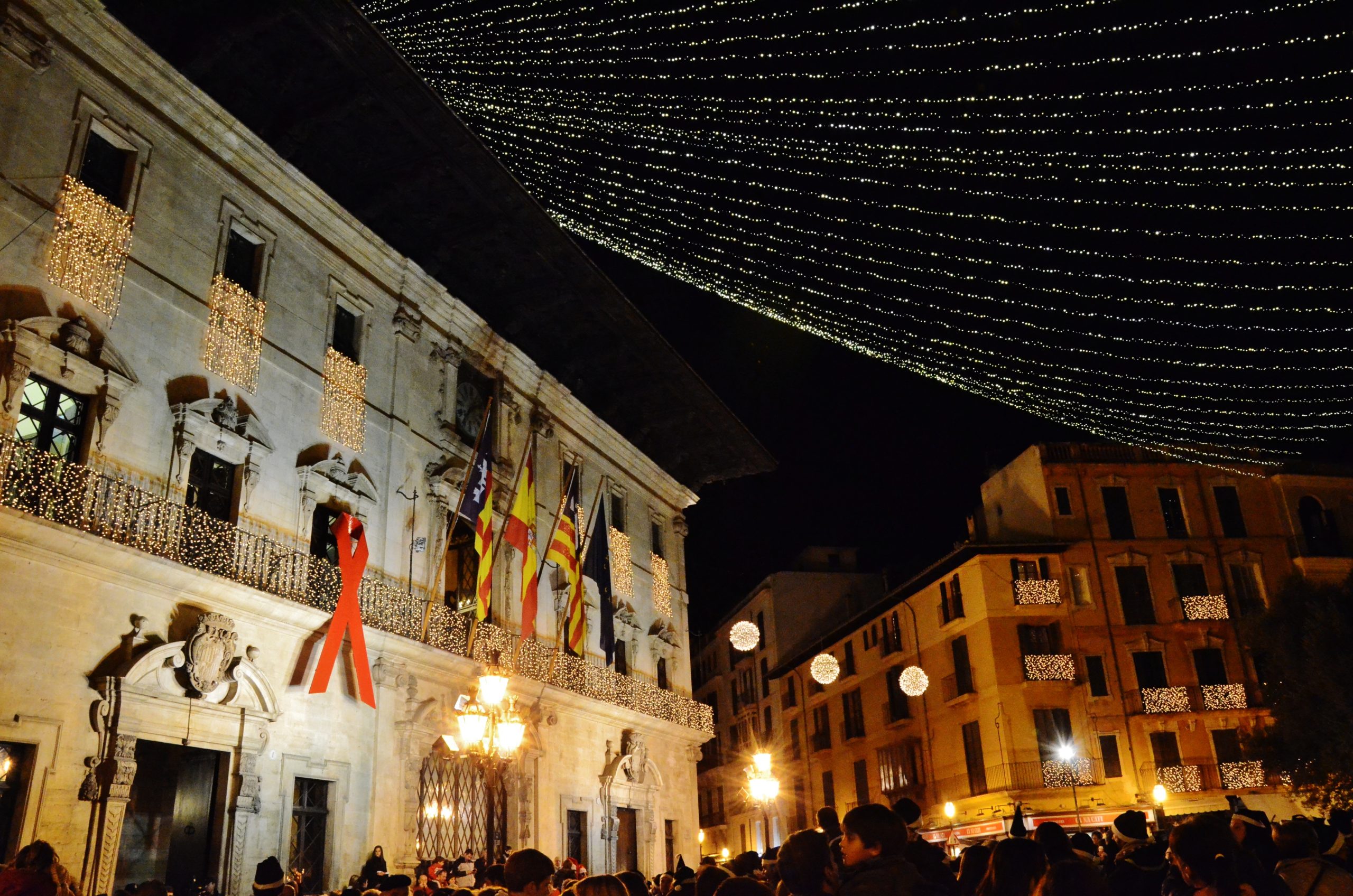 Palma town hall in Plaça de Cort decorated with Christmas lights at night