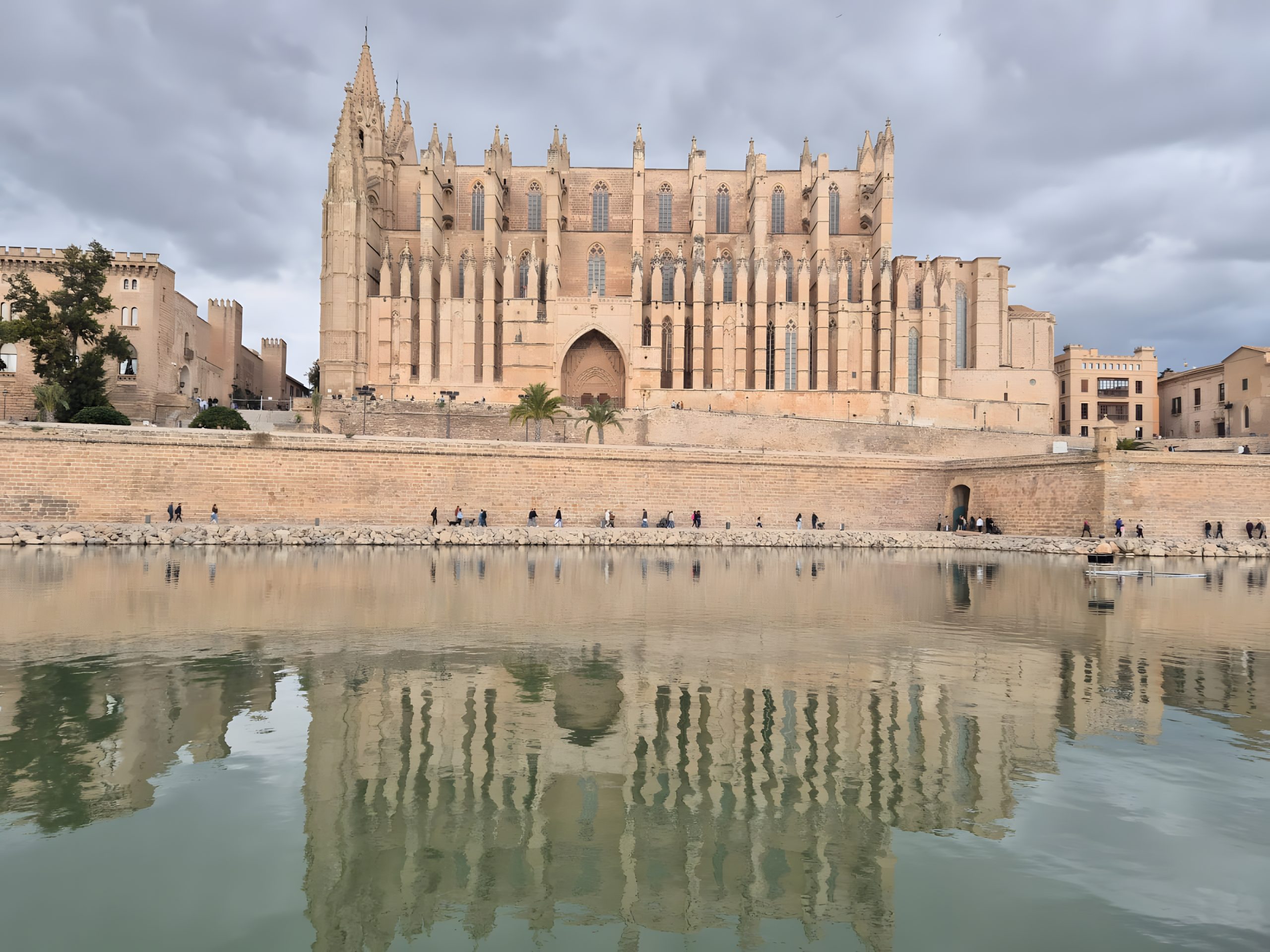 Palma Cathedral reflected in the lake at Parc de la Mar, home of the Parc de Nadal Christmas market